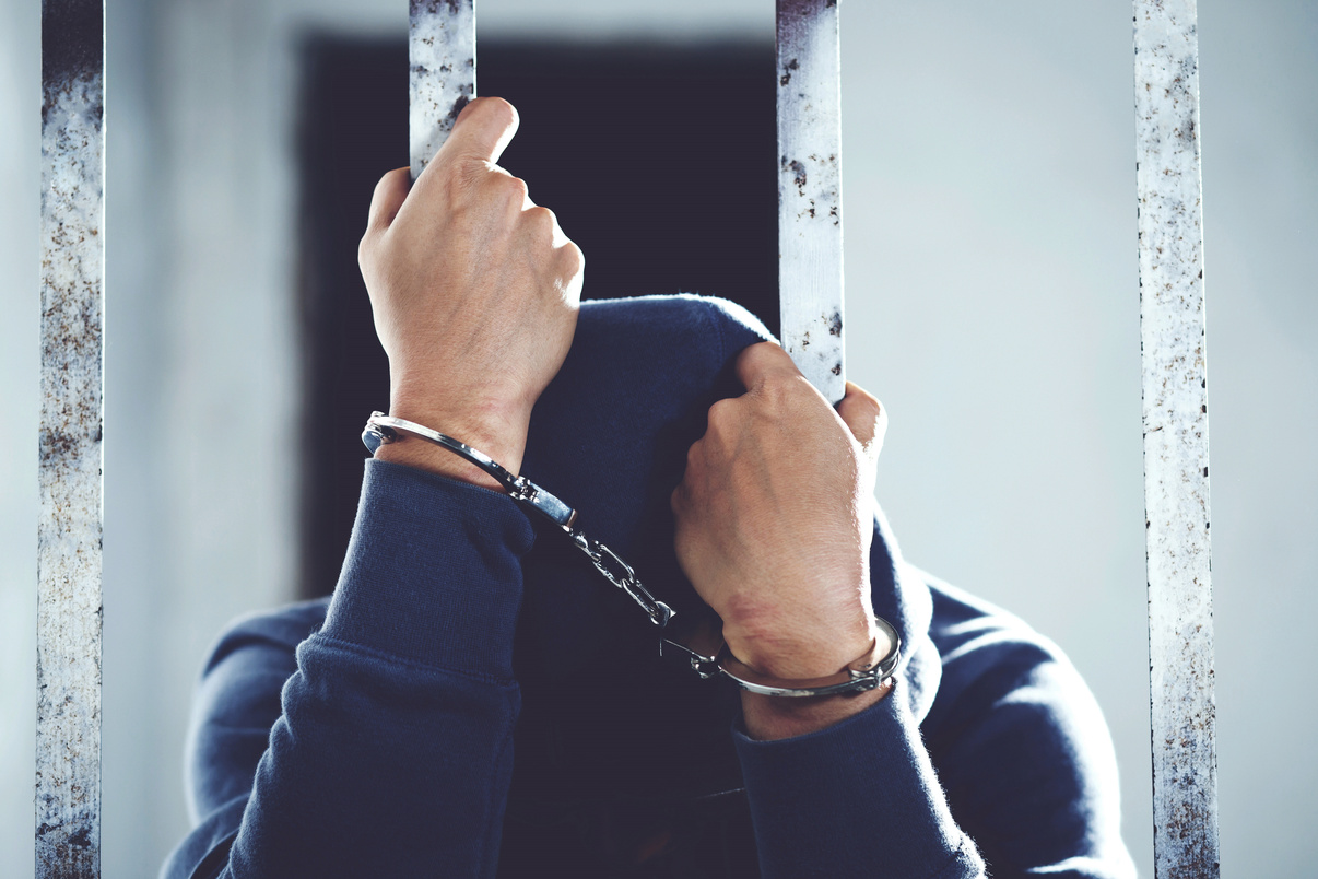 Imprisoned Man in Handcuffs